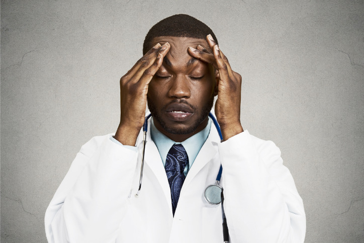 Doctor with headache
